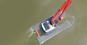 aerial shot of a crane on the water